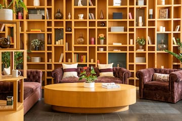 a room with a coffee table and couches