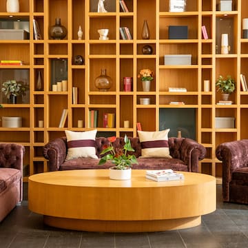 a room with a coffee table and couches