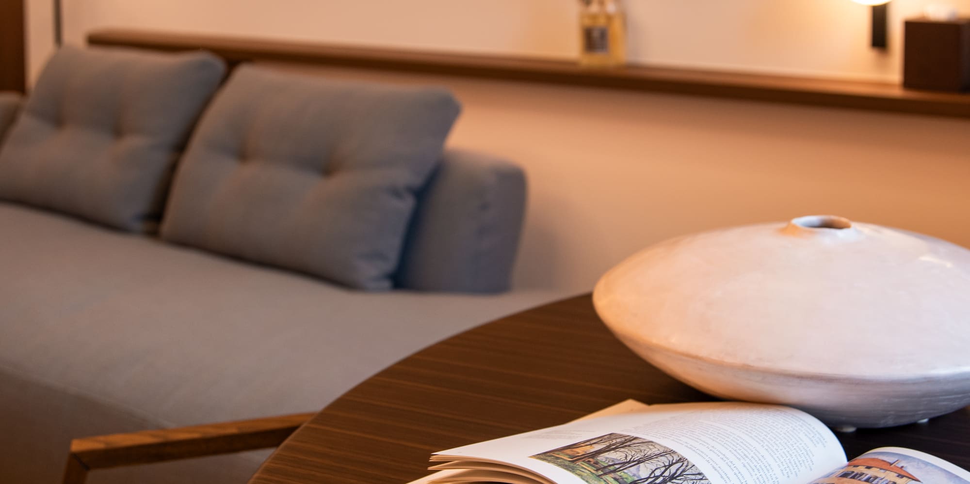 a table with a book and glasses on it