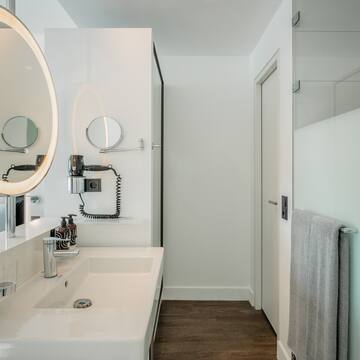 a bathroom with a mirror and sink