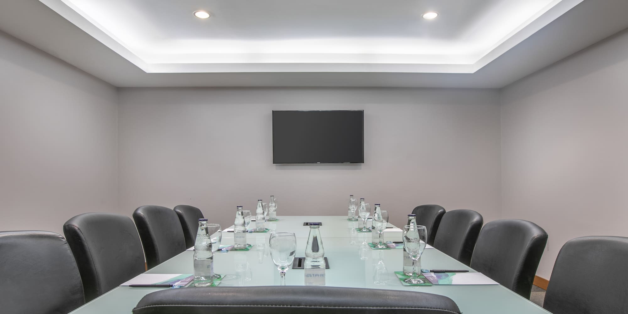 a conference room with a table and chairs