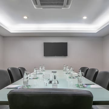 a conference room with a table and chairs