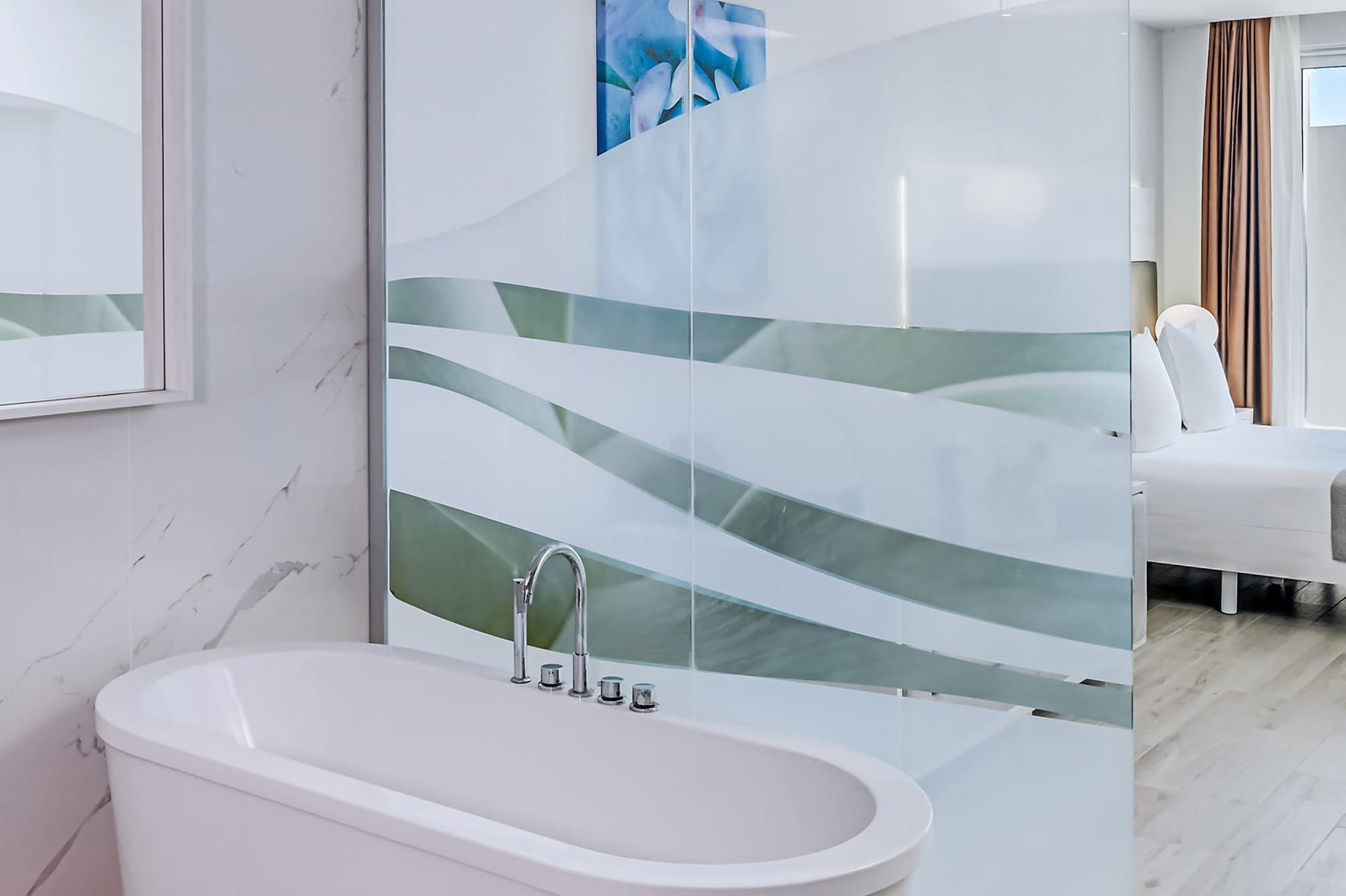 a bathroom with a glass shower door