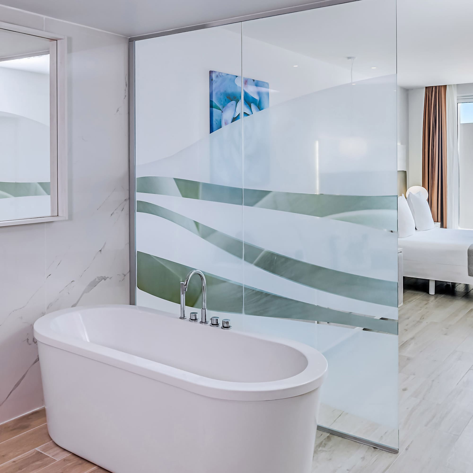 a bathroom with a glass shower door