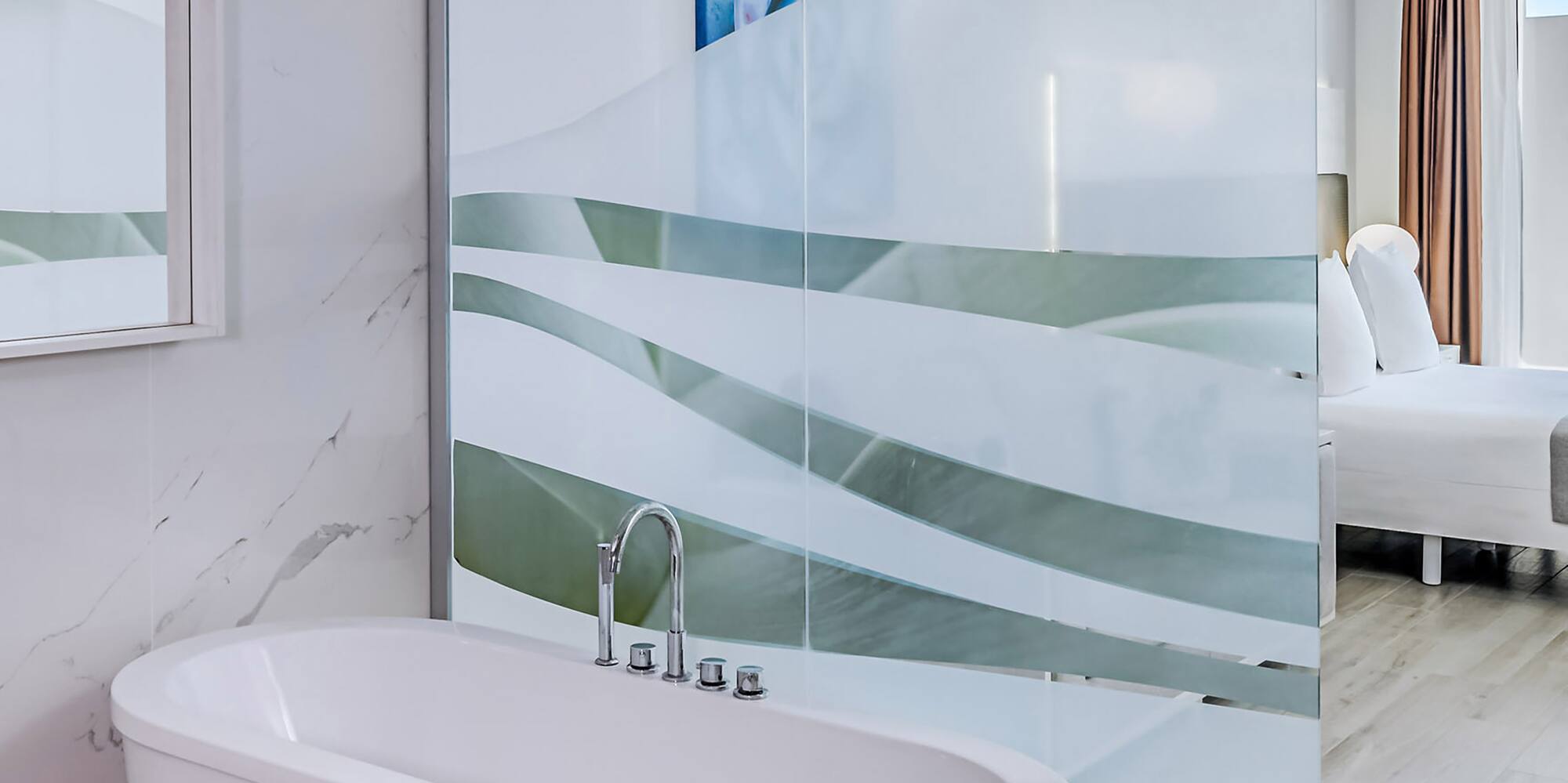 a bathroom with a glass shower door