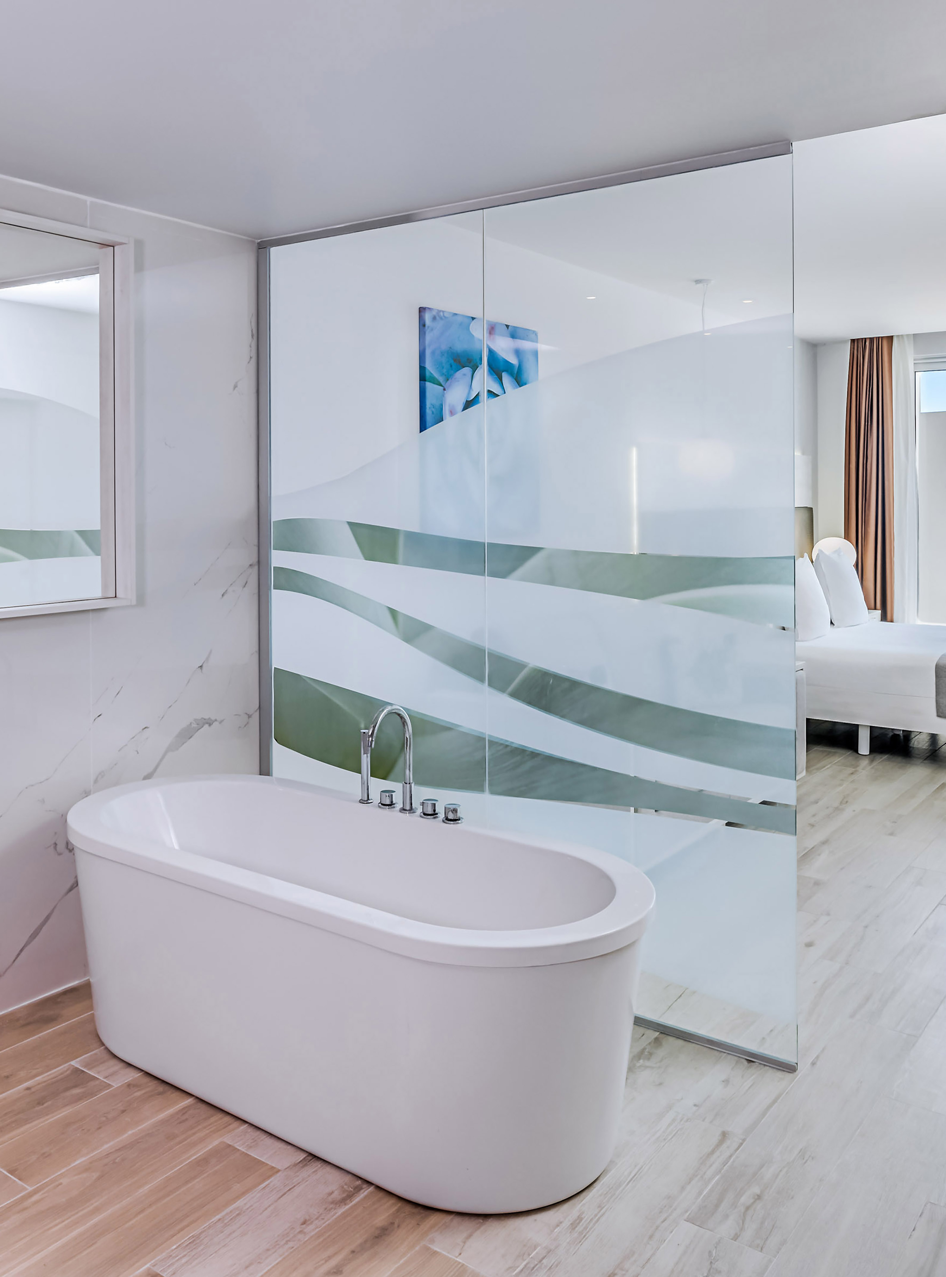 a bathroom with a glass shower door