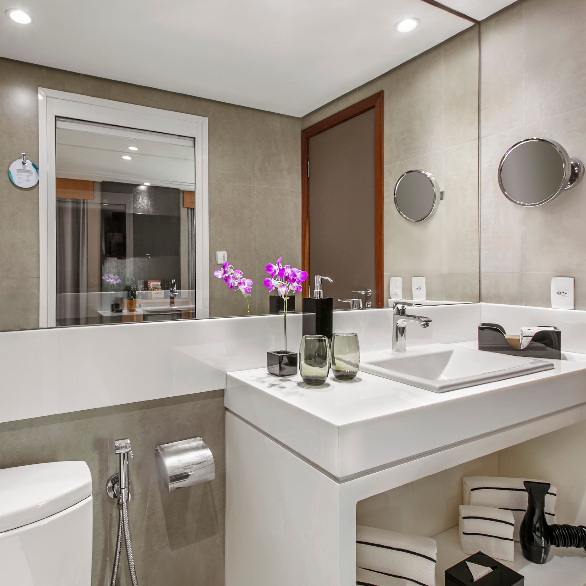 a bathroom with a sink and toilet