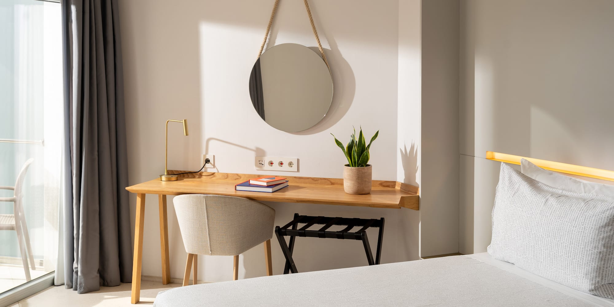 a room with a mirror and a desk