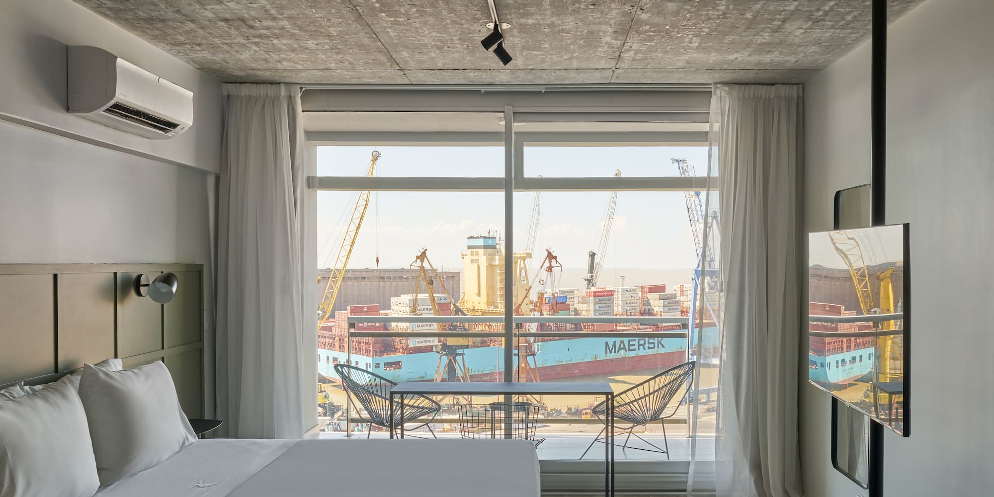 a room with a bed and a window