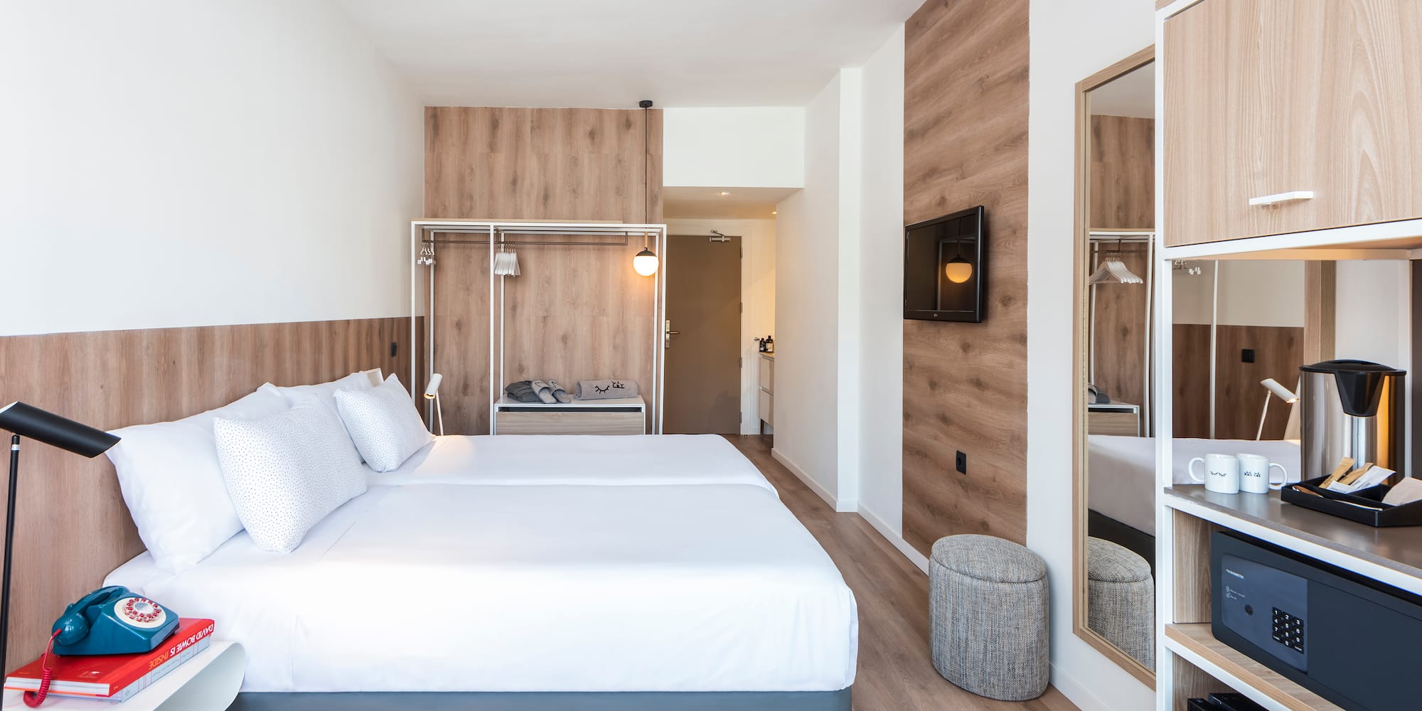 a room with a bed and a mirror