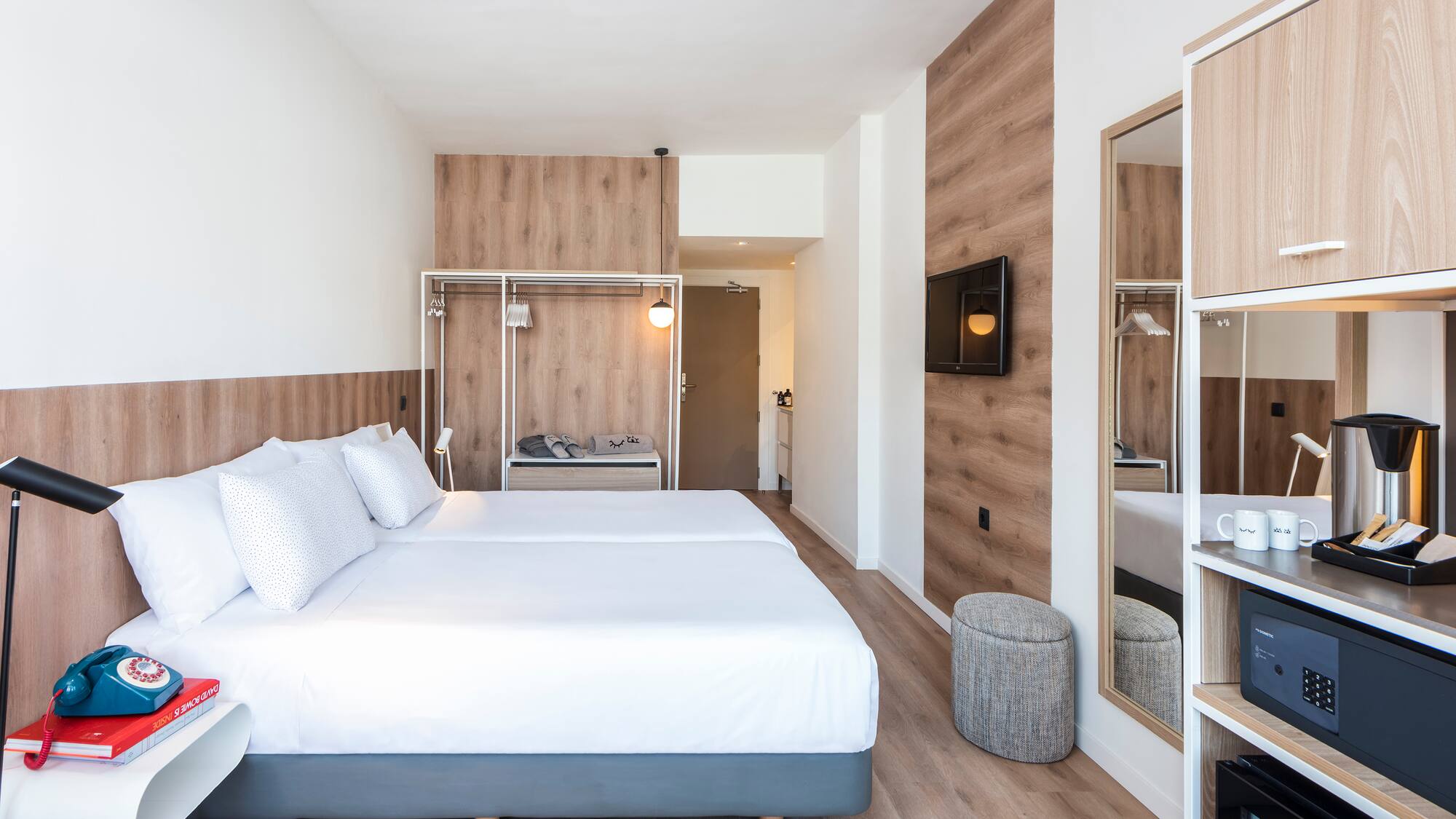 a room with a bed and a mirror