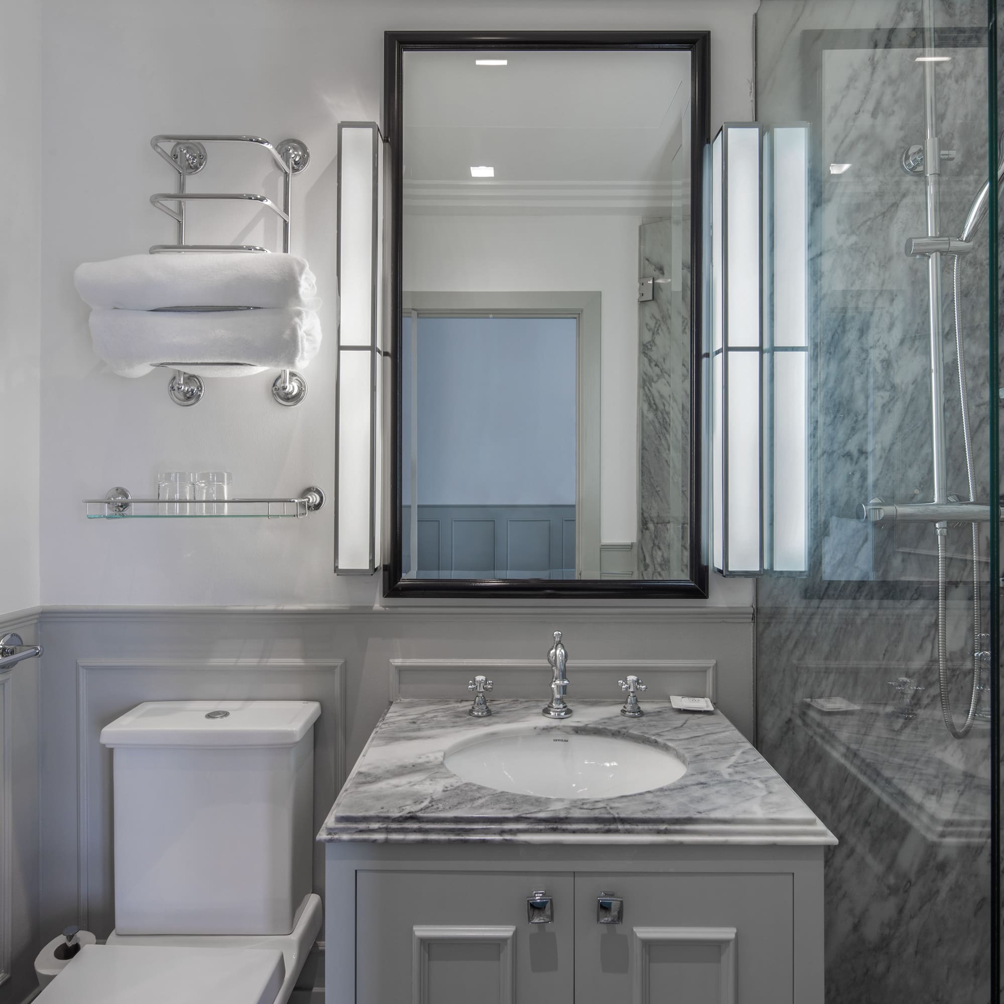 a bathroom with a mirror and sink