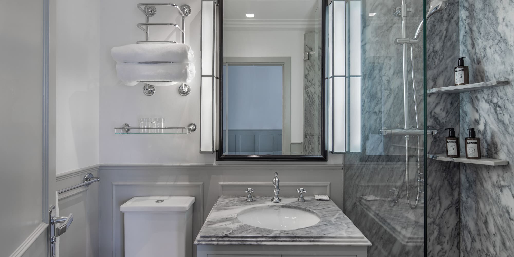 a bathroom with a mirror and sink