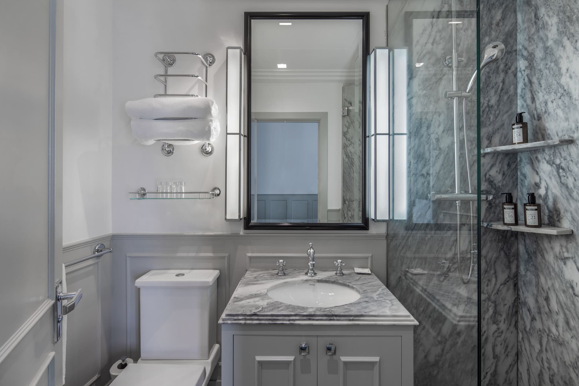 a bathroom with a mirror and sink