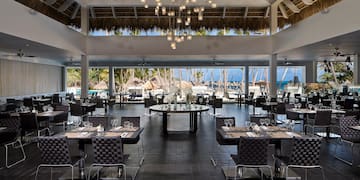 a restaurant with tables and chairs