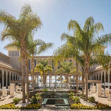 a building with palm trees