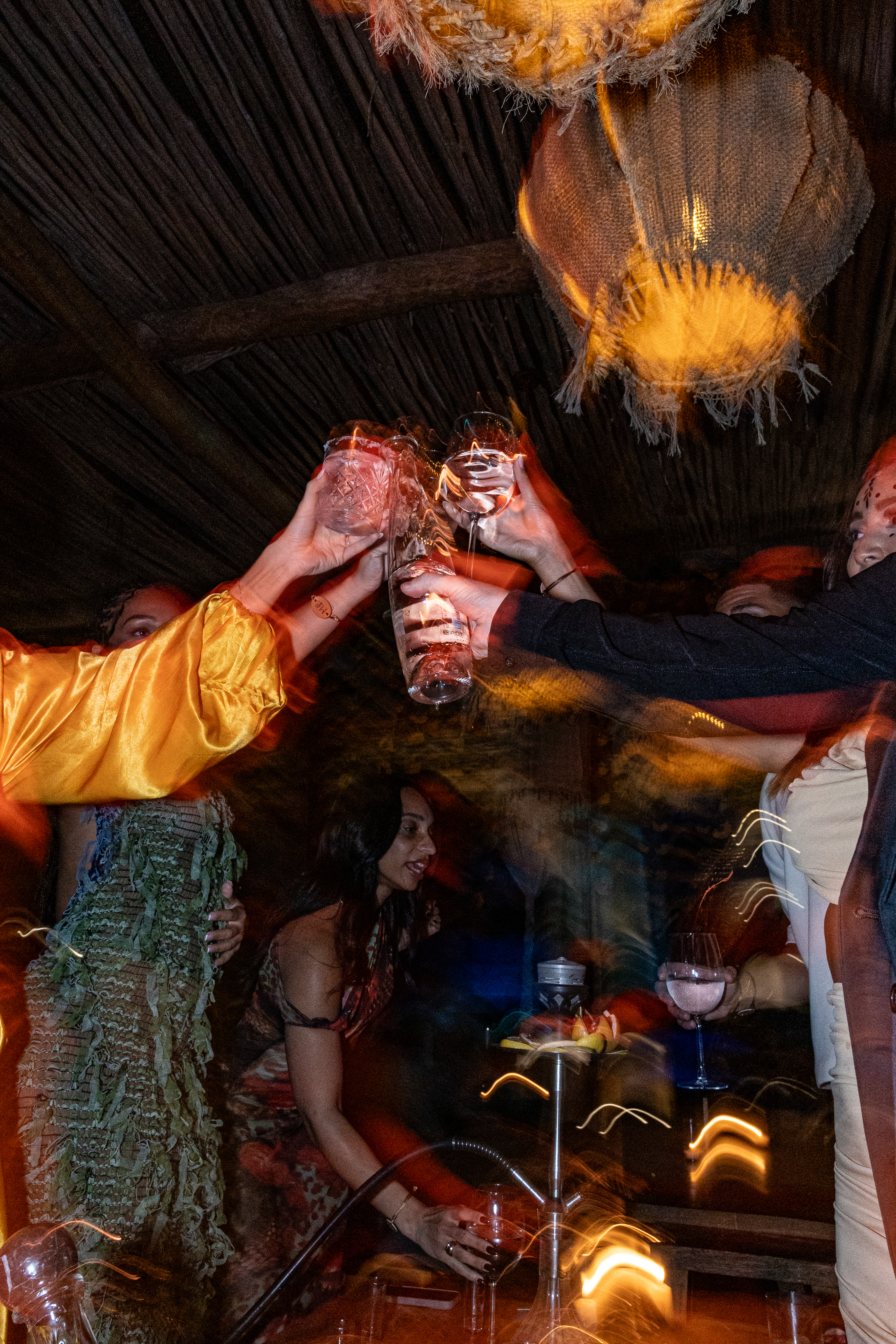 a group of people clinking glasses at a party