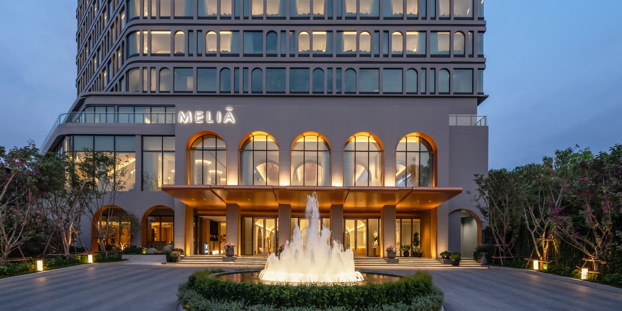 a building with a fountain in front of it