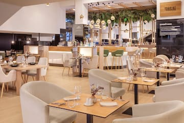 a restaurant with tables and chairs