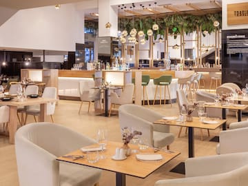 a restaurant with tables and chairs