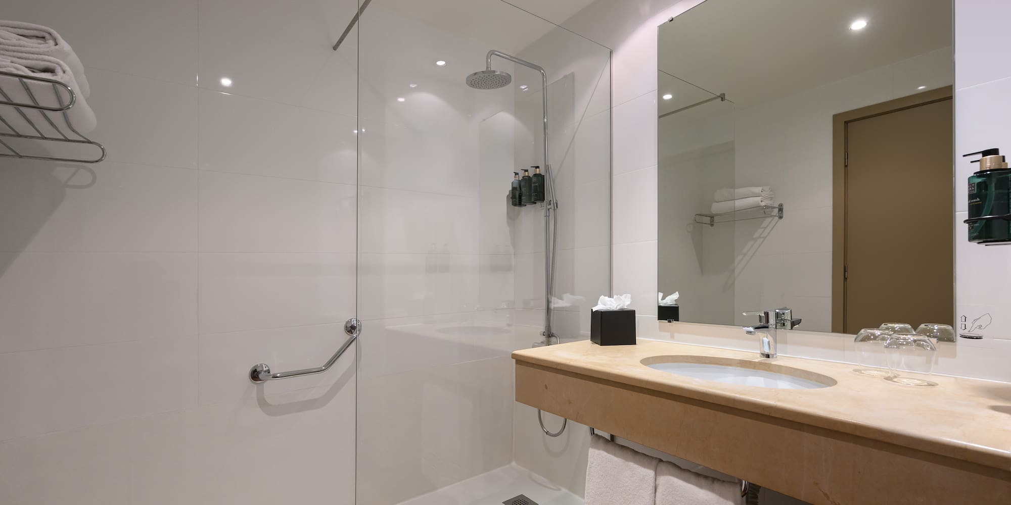 a bathroom with a shower and sink