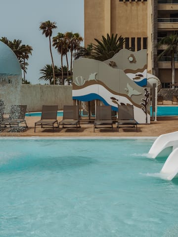 a water slide in a pool