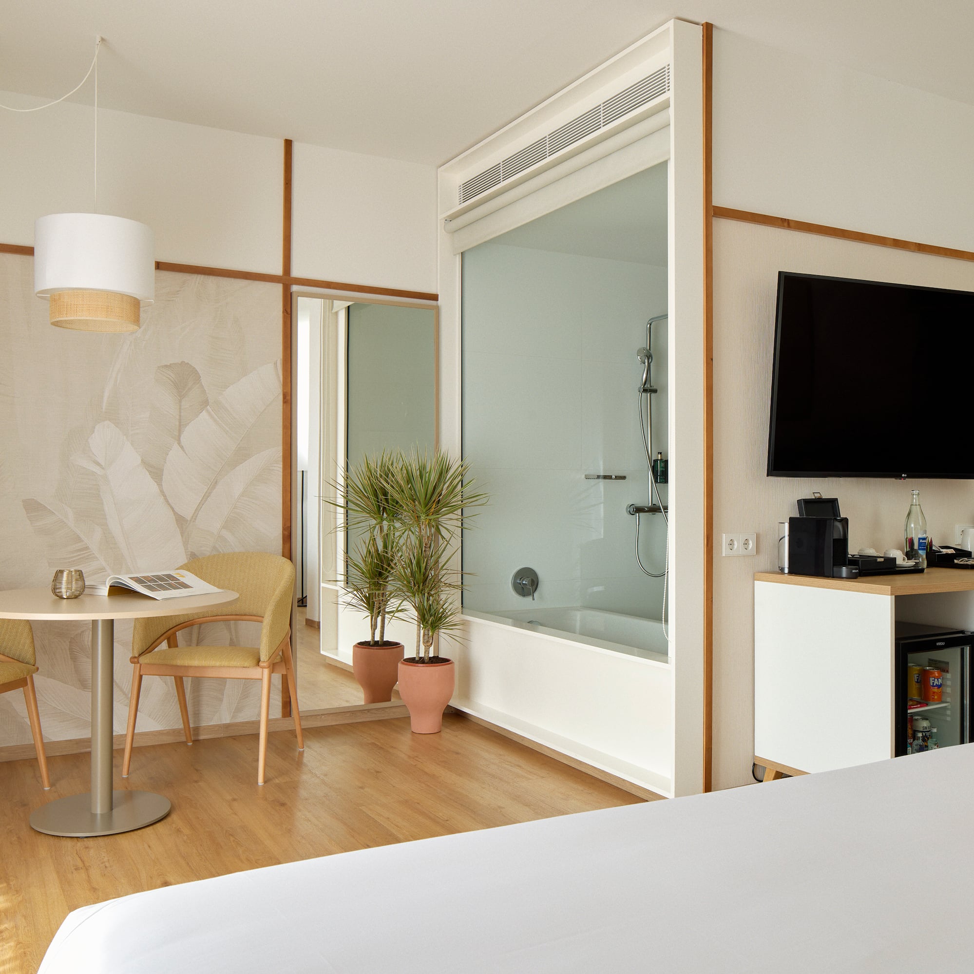 a room with a tv and a bathtub