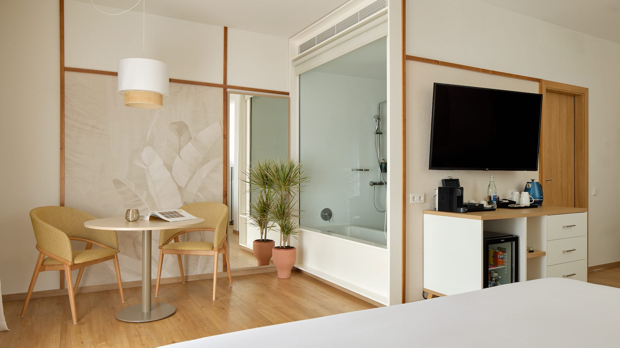 a room with a tv and a bathtub