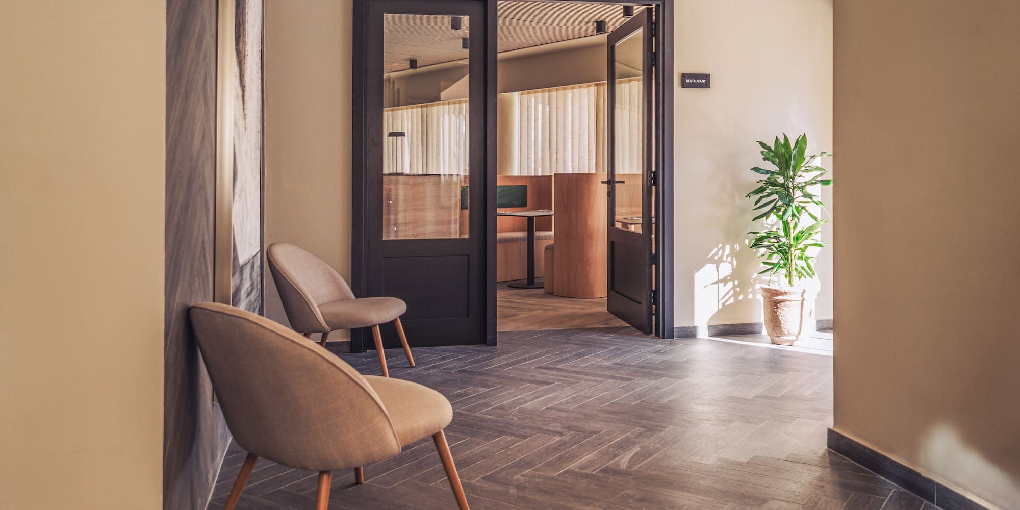 a room with chairs and a door