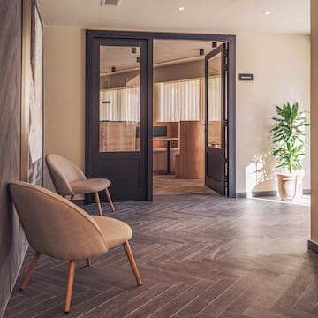 a room with chairs and a door