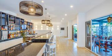 a bar with a counter and stools