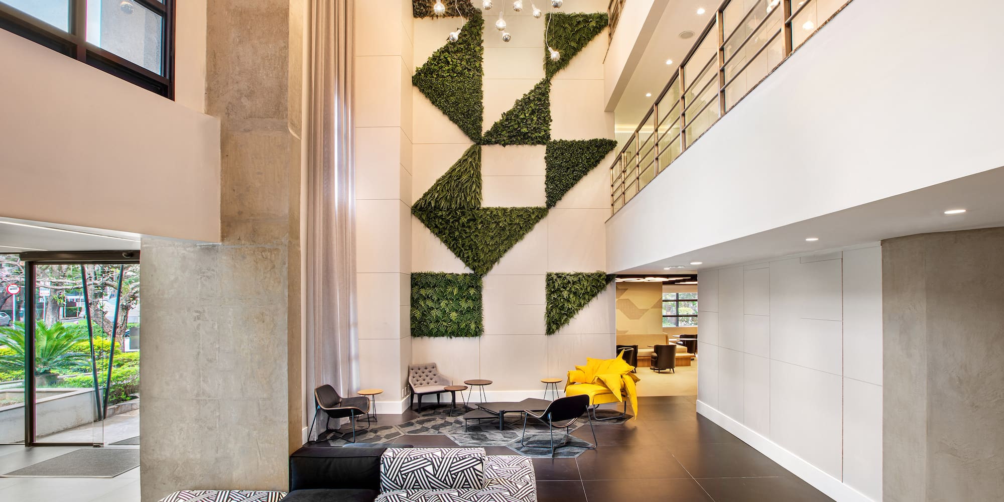 a room with a wall and plants on the wall