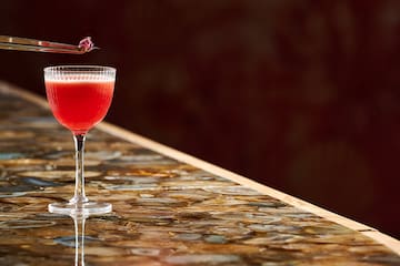 a glass with a drink in it