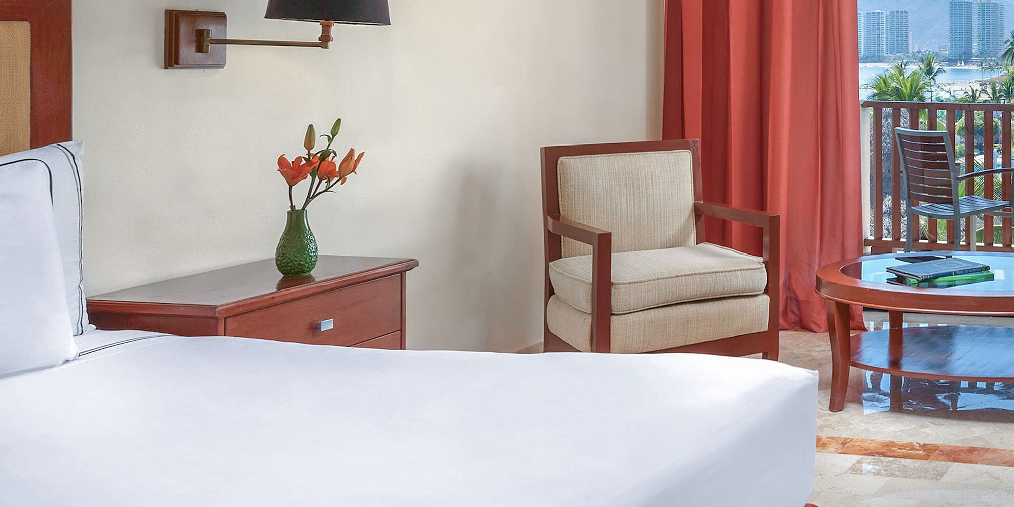 a room with a bed and chair