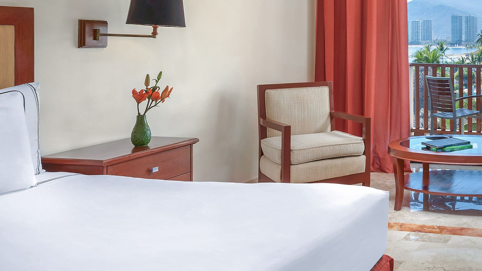 a room with a bed and chair