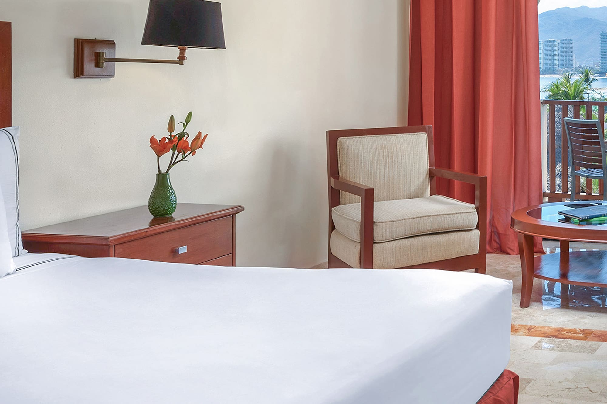 a room with a bed and chair