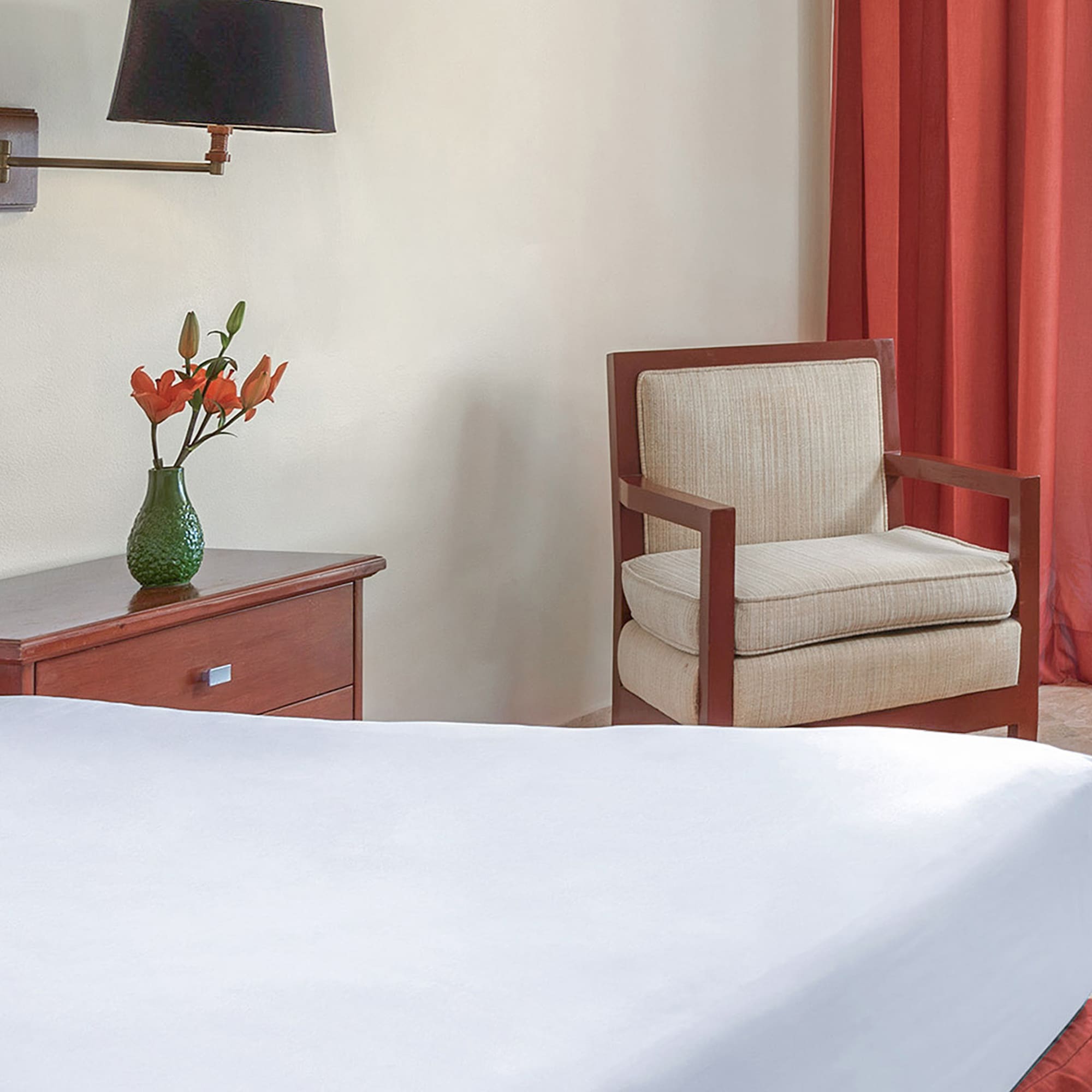 a room with a bed and chair