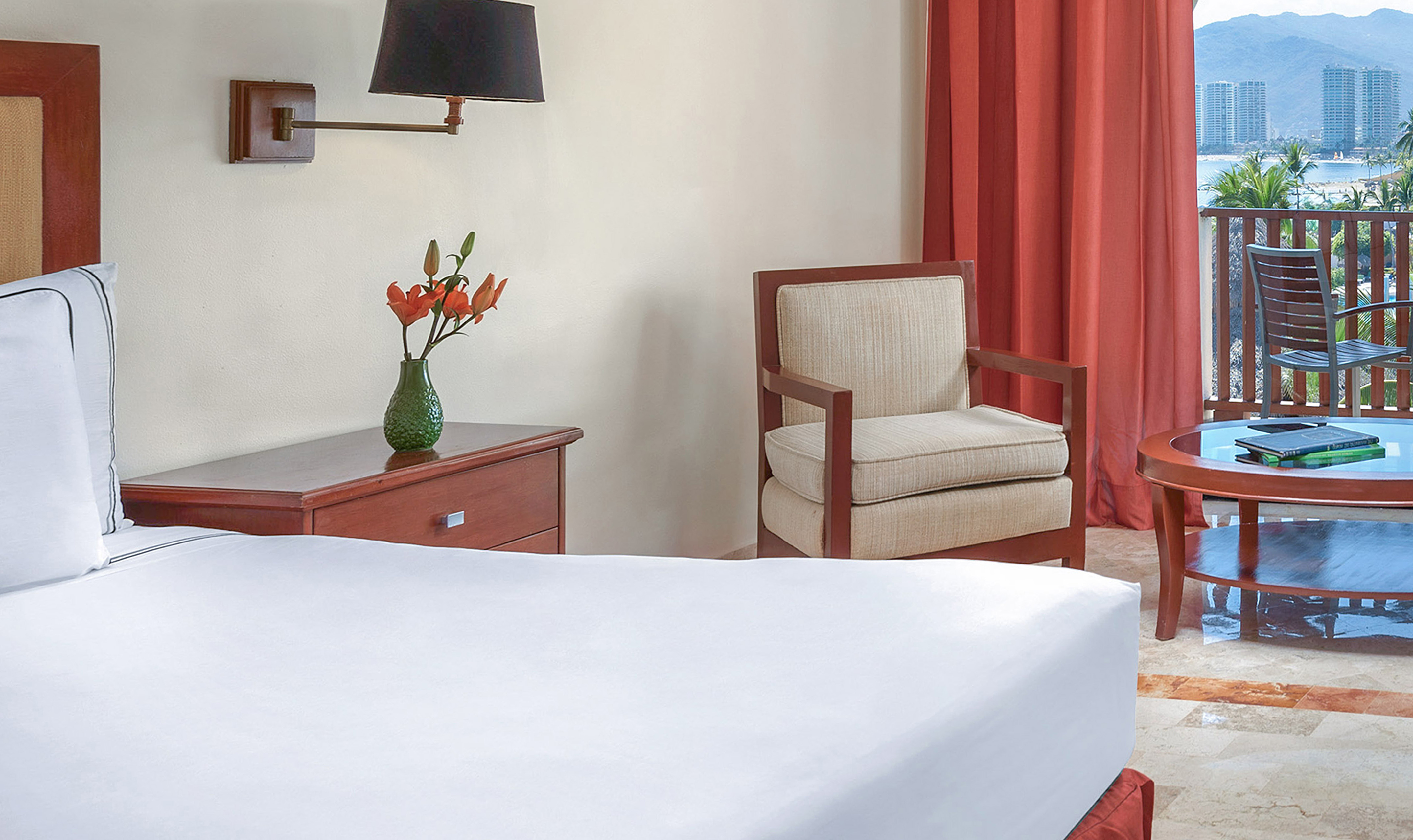 a room with a bed and chair