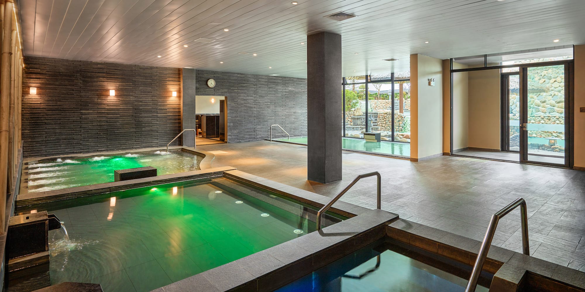a indoor pool with green water