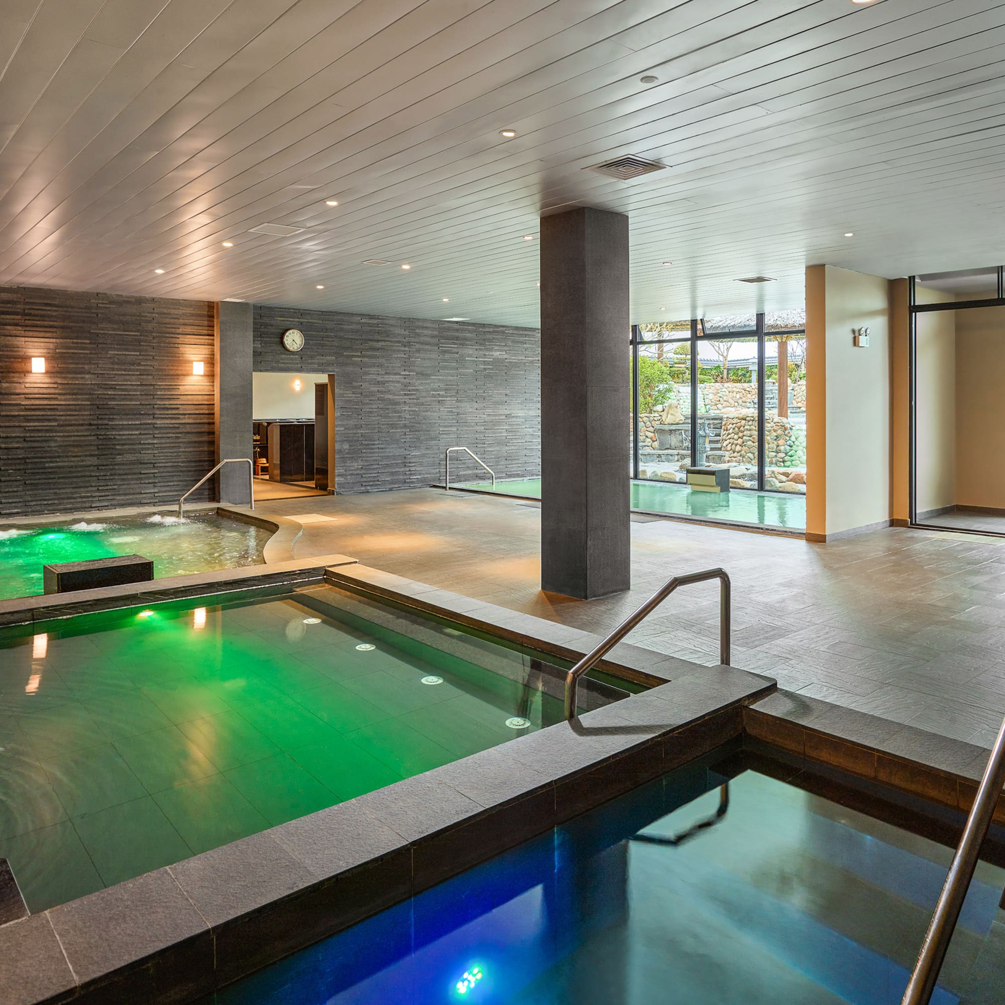 a indoor pool with green water