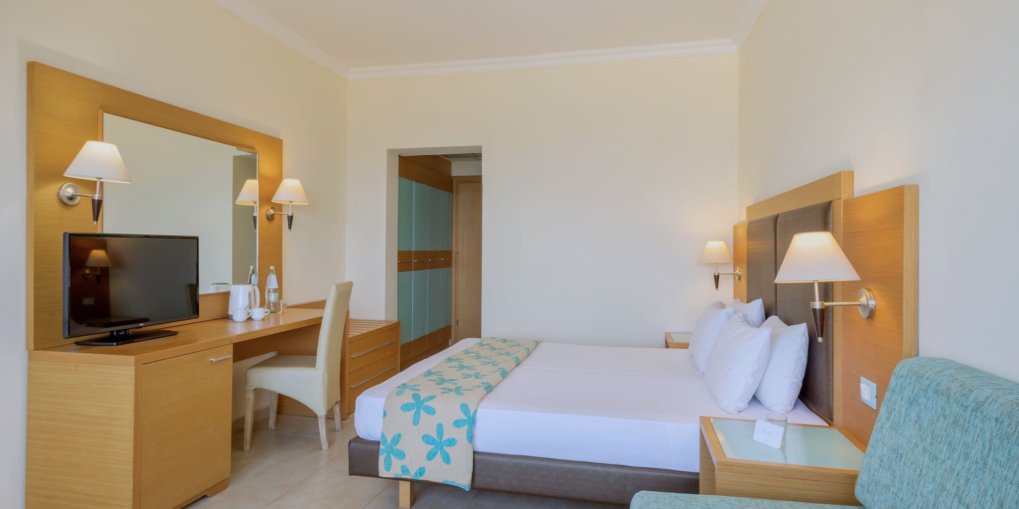 a room with a bed and a desk