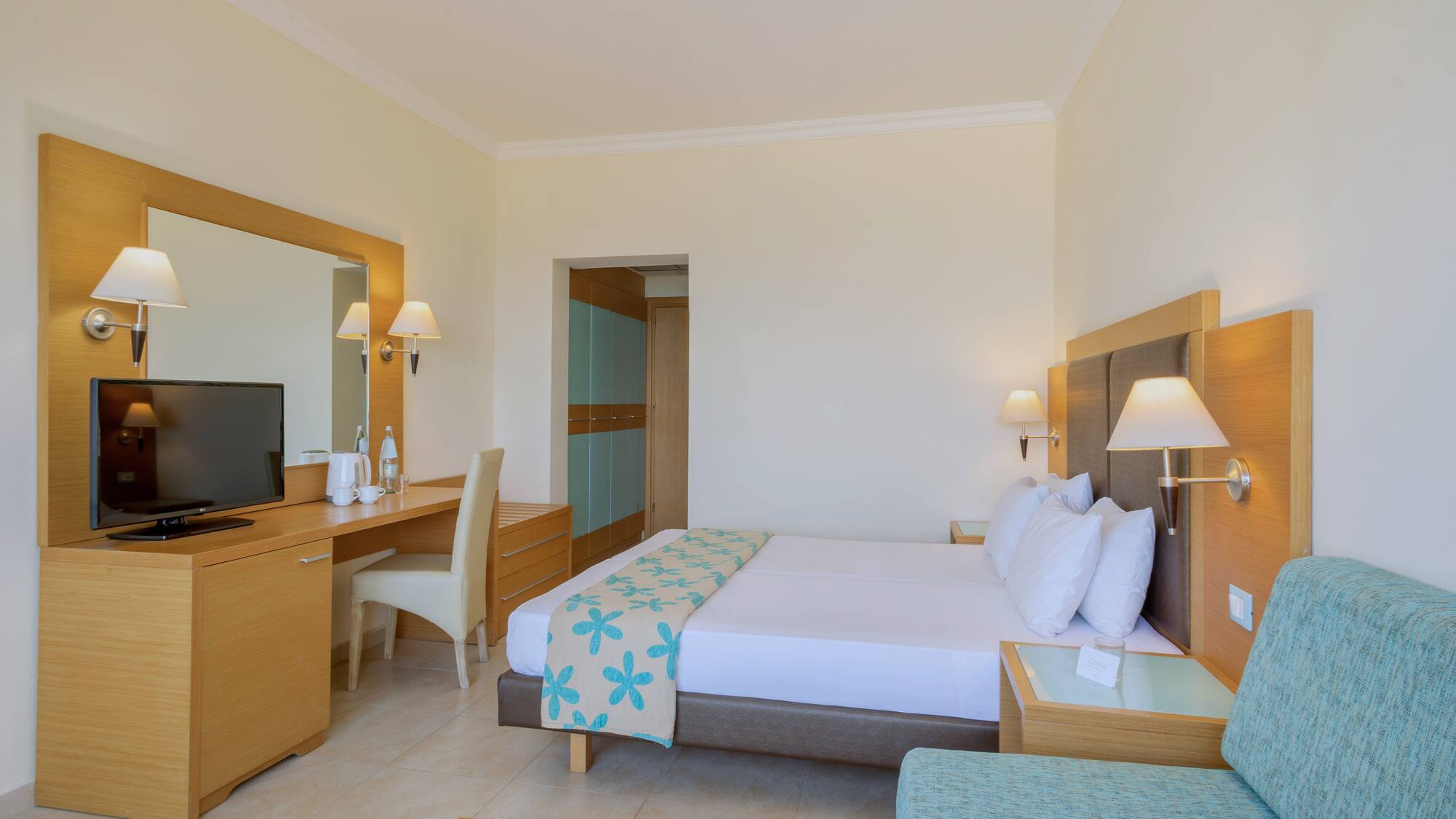 a room with a bed and a desk