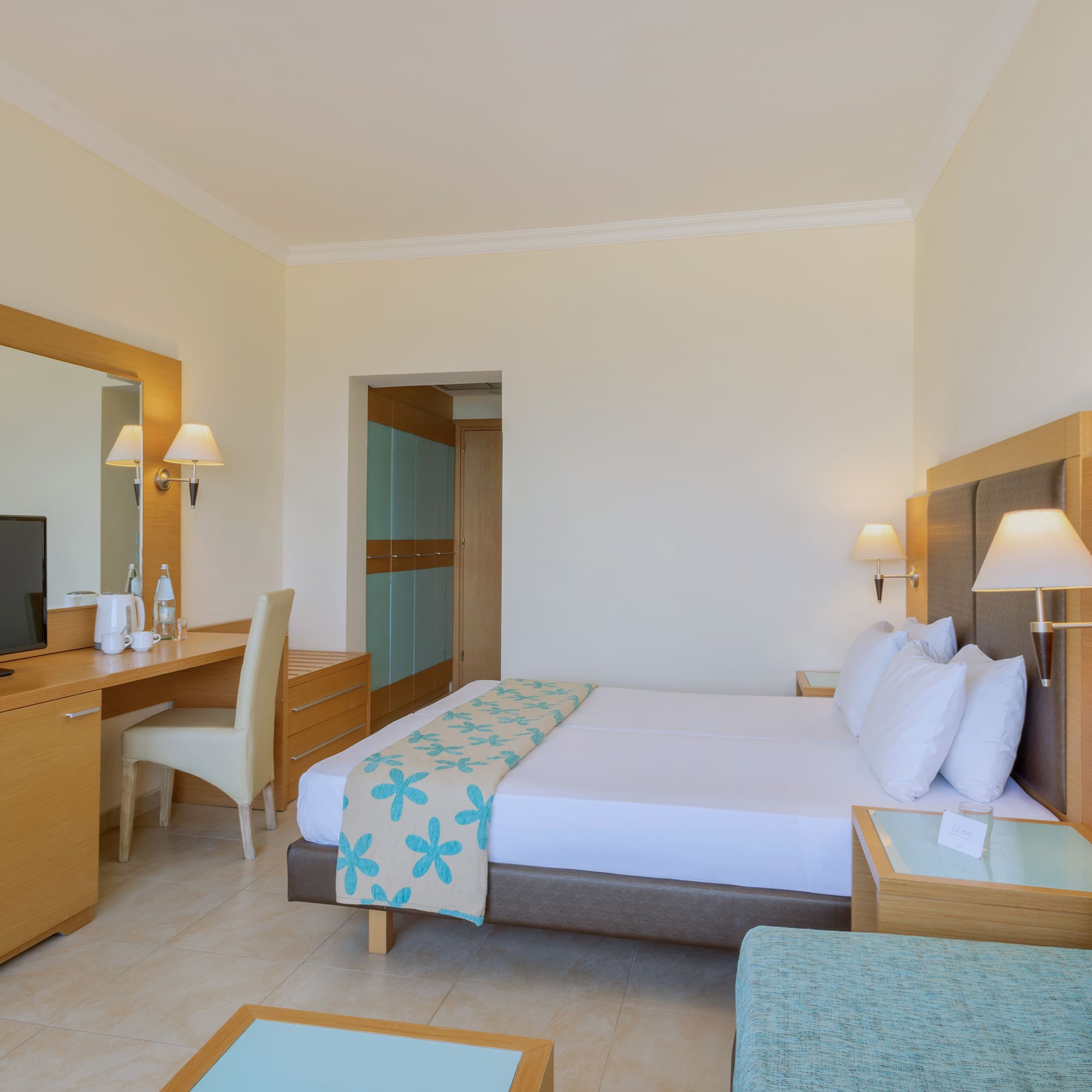 a room with a bed and a desk