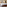 Modern hotel bedroom, king bed, wood headboard, bedside lamps, woven bench.