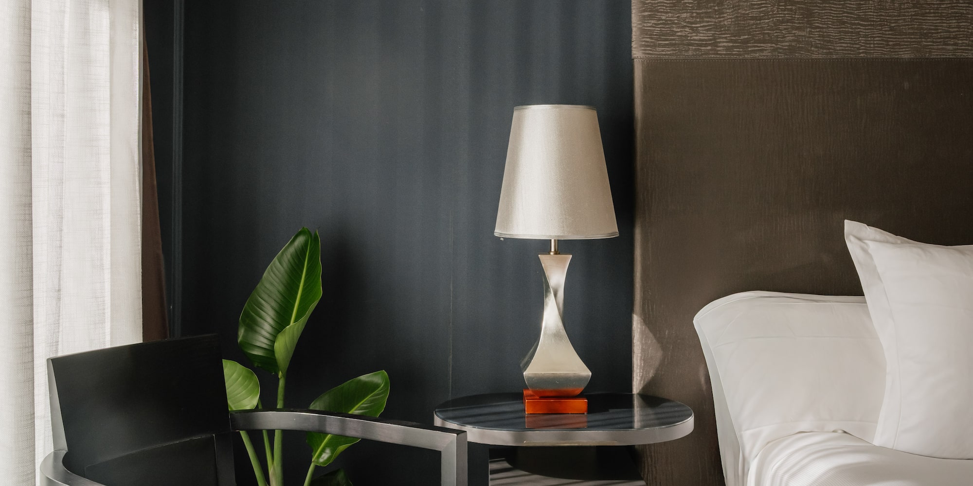 a room with a bed and a lamp