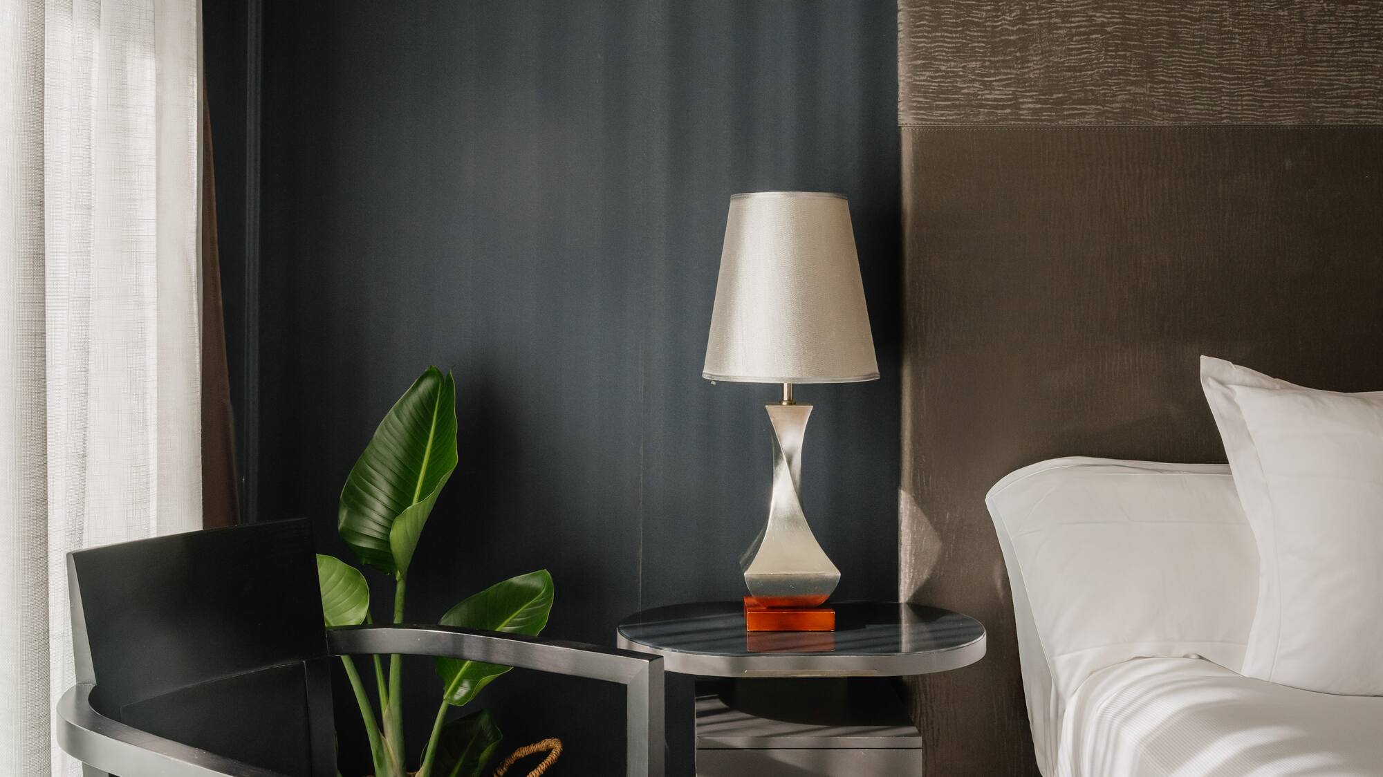 a room with a bed and a lamp