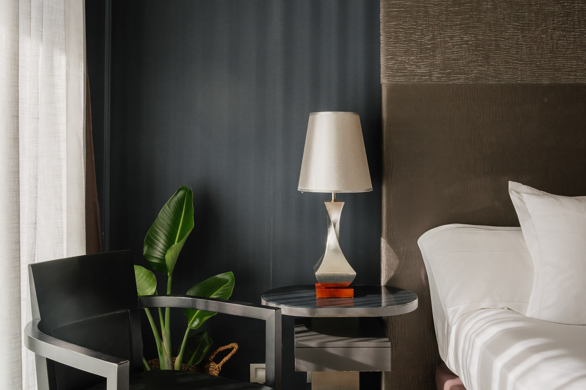 a room with a bed and a lamp