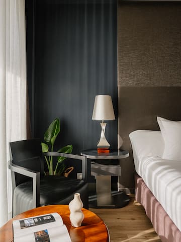 a room with a bed and a lamp