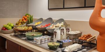a buffet table with different food items on it