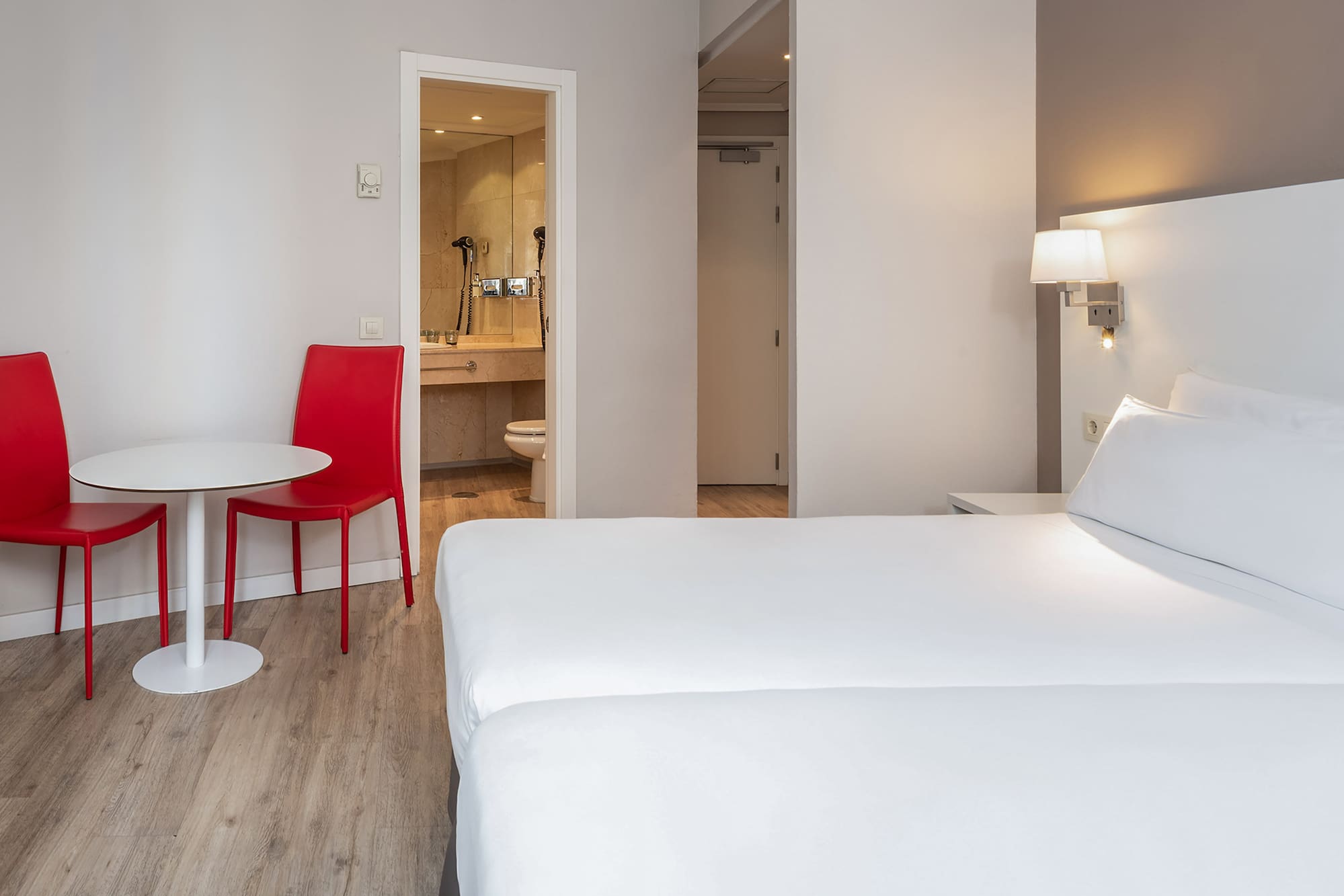 a room with a table and chairs